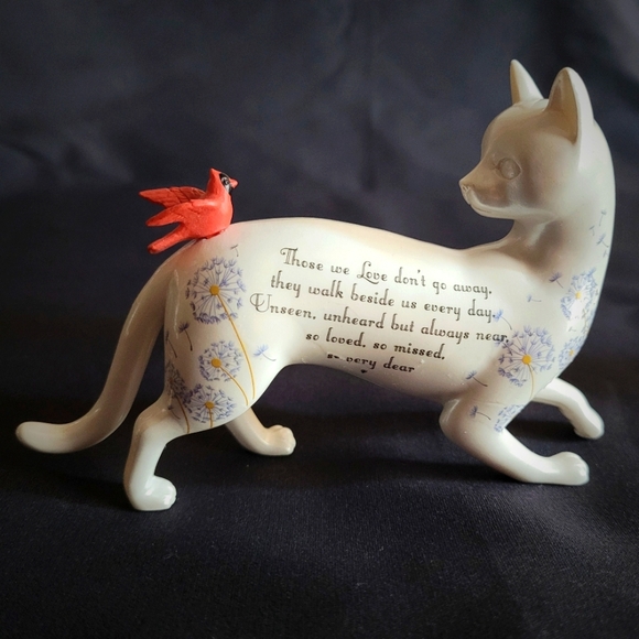 White Cat Looking Back at a Red Bird That Had Landed on His Back - Picture 1 of 12